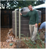 Chris Meador installing rainwater tank